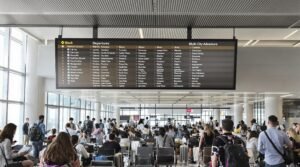 Travelers in airport lounge planning multi-city adventure
