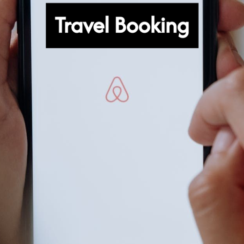 Traveler booking a trip online with devices